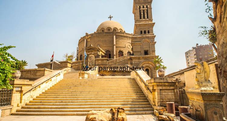 Stone staircase leading up to a domed church with a bell-tower under a bright blue sky.