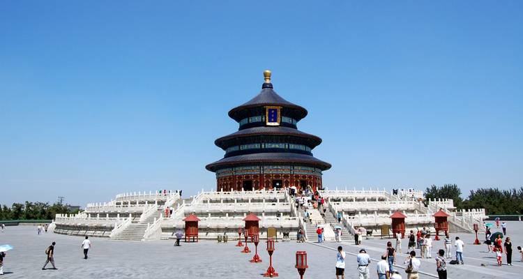 Temple of Heaven Hall of Prayer for Good Harvests under clear blue sky with visitors scattered around
