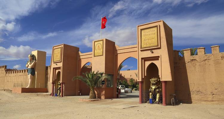 Entrance gate to Atlas Film Studios with Egyptian statues in Ouarzazate