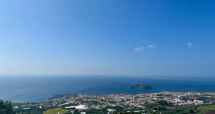 Coastal town of Vila Franca do Campo with its offshore islet seen from a high viewpoint.