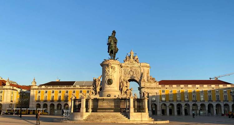Early morning light bathes the grand statue of King José I and the Arco da Rua Augusta at Lisbon’s Praça do Comércio.