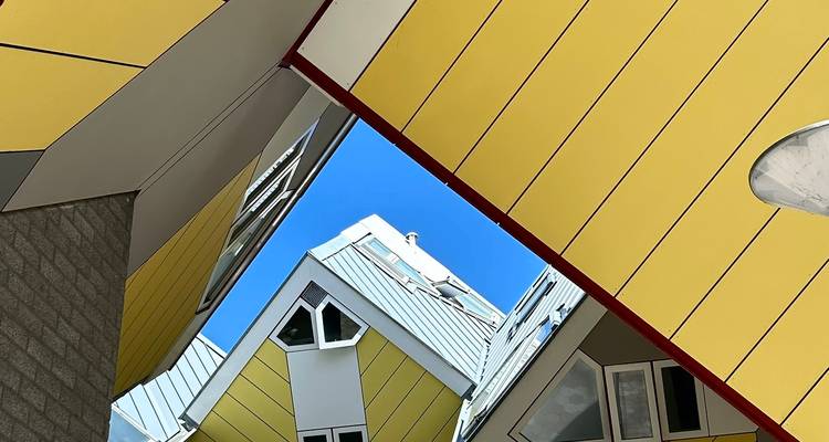 Abstract upward perspective of Rotterdam cube houses framing a bright blue sky.