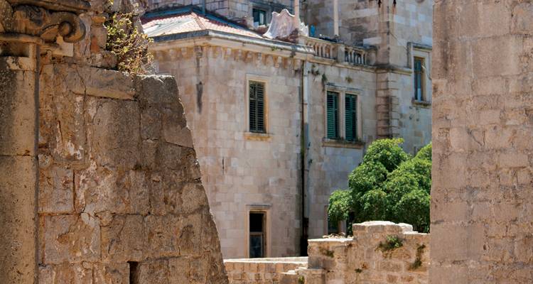 Close view of ancient stone walls and windows within historic palace ruins