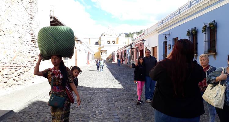 A vibrant street with colorful buildings and people walking.