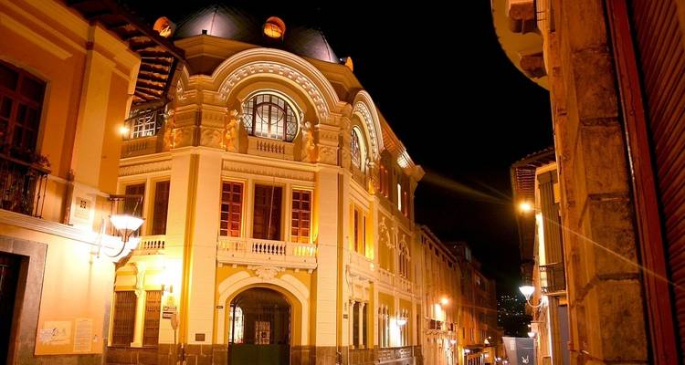 Illuminated historic building at night.