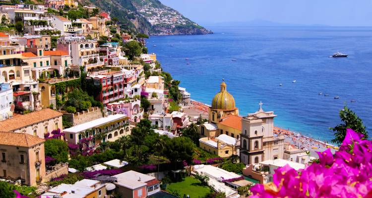 Vibrant coastal town cascading down a hillside towards the sea