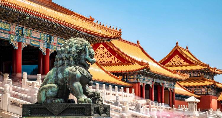 Traditional Chinese architecture with a statue of a lion.