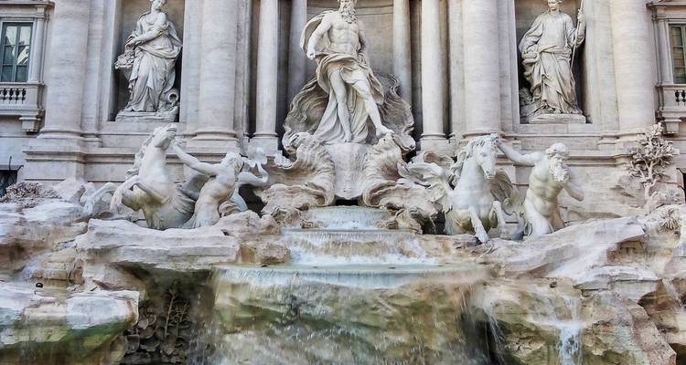 Marble statues and cascading water of the iconic Trevi Fountain in Rome.