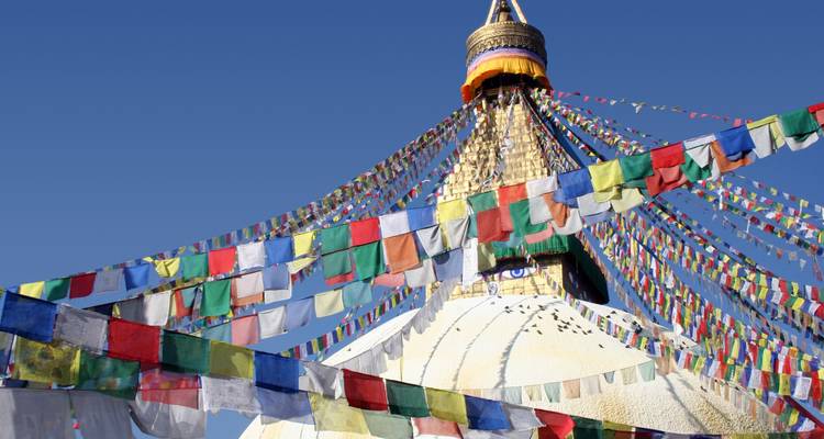 Stupa surrounded by colorful prayer flags.