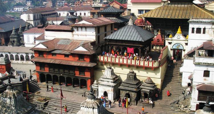Aerial perspective of Pashupatinath Temple complex with crowded terraces and intricate rooftops.