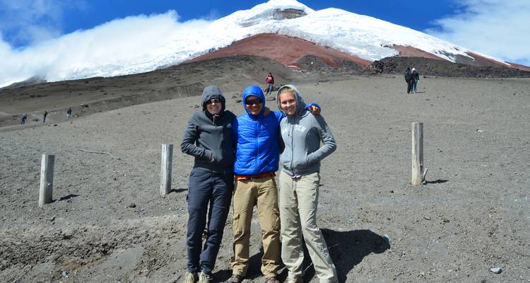 Group of people posing near Cotopaxi Volcano.