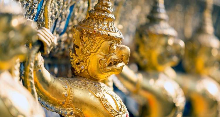 Sculpture of Garuda figures decorated in gold and jewels.