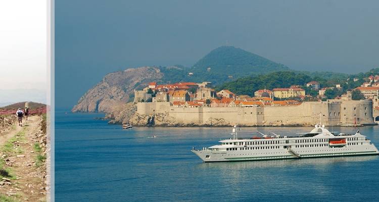 Cité historique fortifiée de Dubrovnik surplombant la mer Adriatique avec un navire de croisière blanc qui passe à proximité