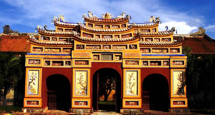 Ornately decorated entrance gate in vibrant colors with artistic designs.