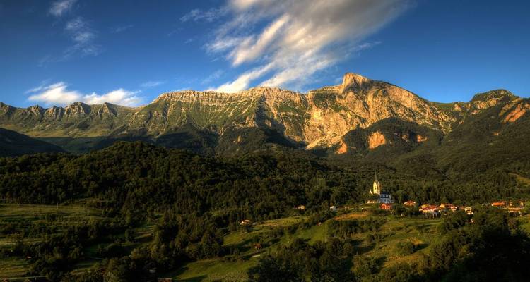 Scenic view of mountains and valley with a small village